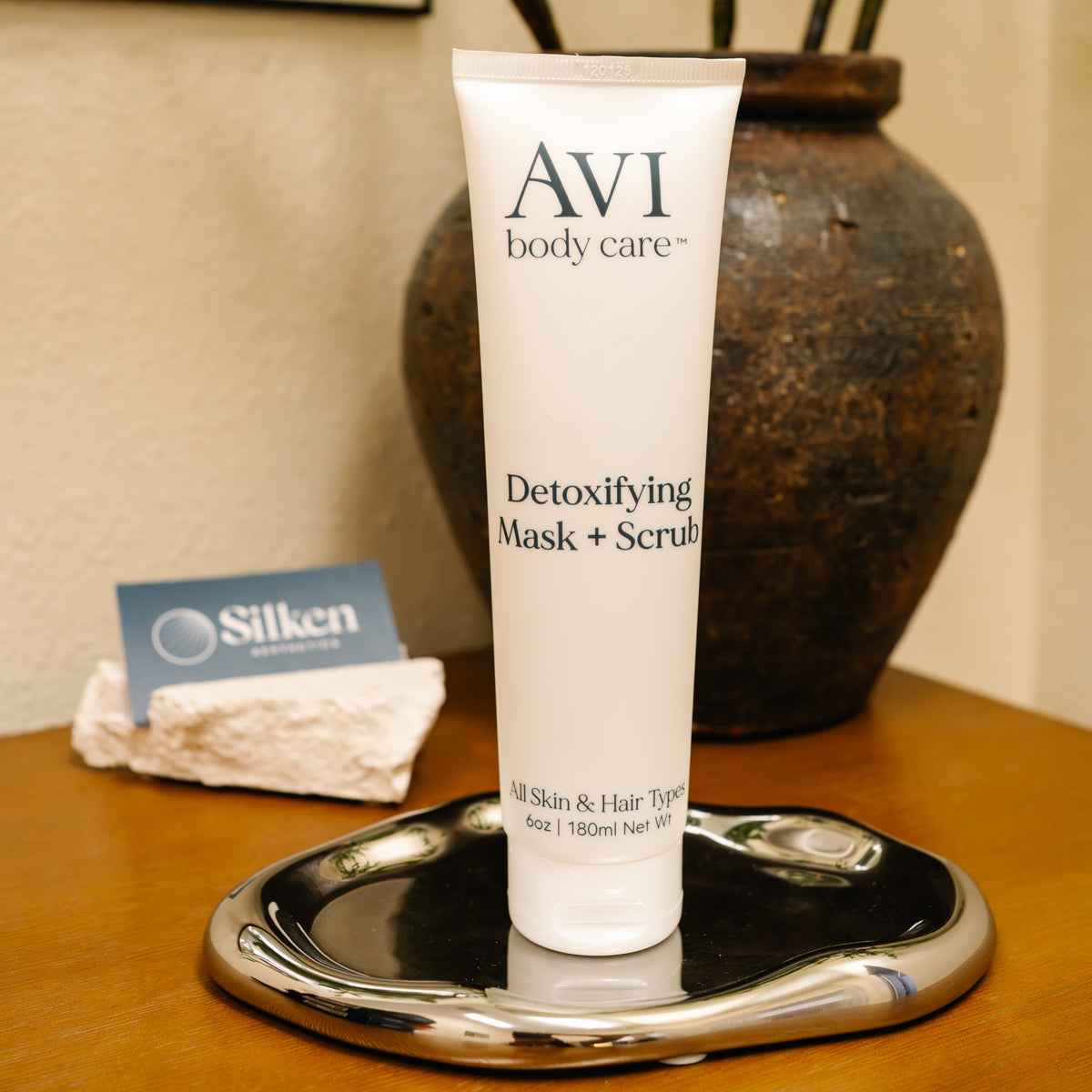 Ingrown hair exfoliator in white bottle