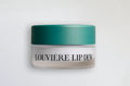 Jar of Louvière Lip Dew on a white background