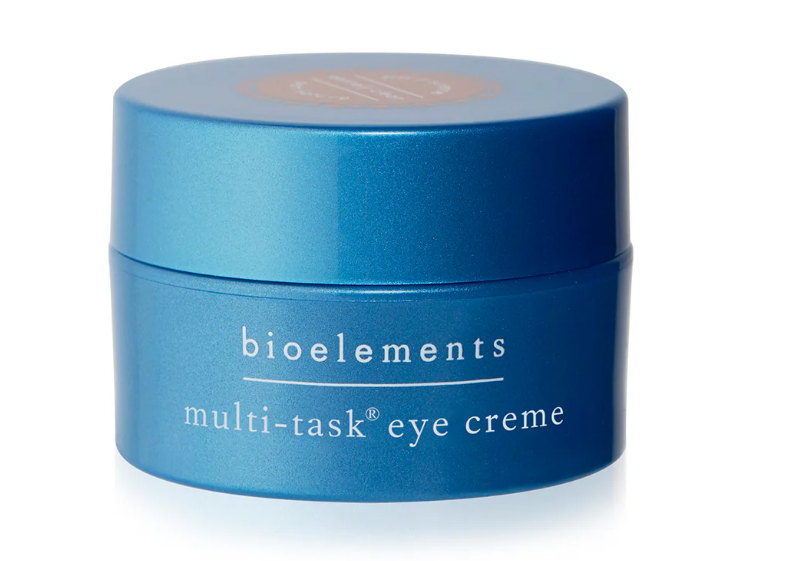 Blue jar of bioelements multi-task eye crème on a white background